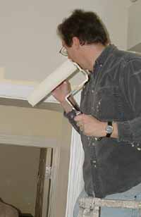 Photo: Rob Bostelaar wields roller.