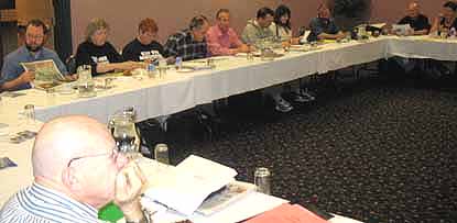 Photo: Arnold Amber presides at meeting